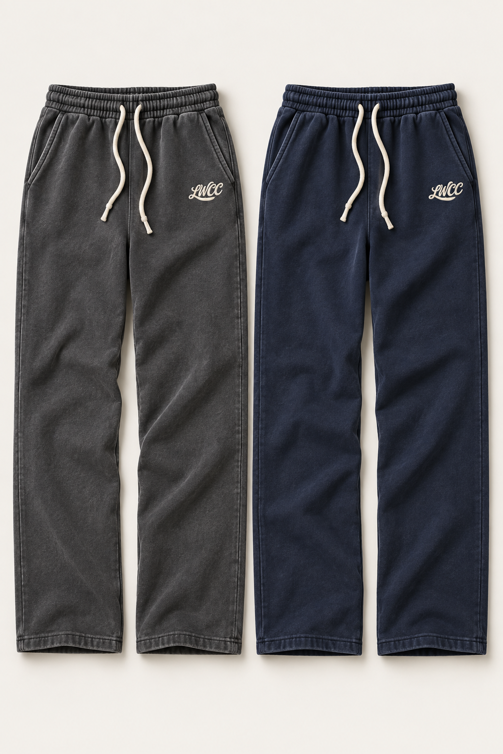 Charcoal and navy straight-leg washed joggers with cream drawstrings and small LWCC hip logos