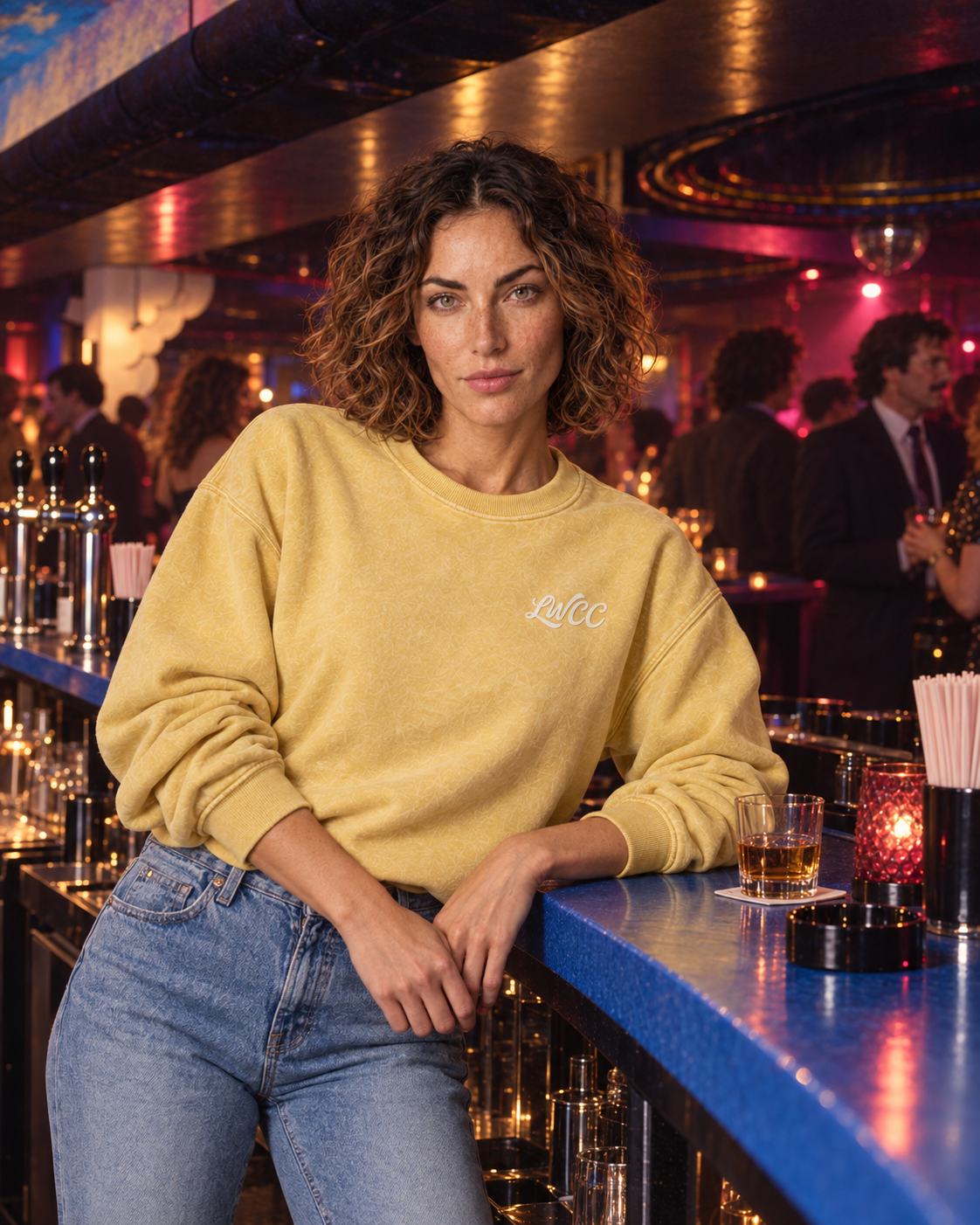Lost Wight model wearing the sun-yellow sweatshirt inside the club